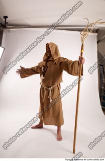 10 2019 01 JOEL ADAMSON MONK STANDING POSE WITH A…